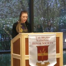 Student talking at a Tau Sigma National Honor Society event