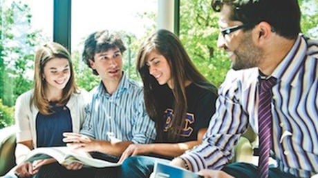 Groups of students studying and smiling.