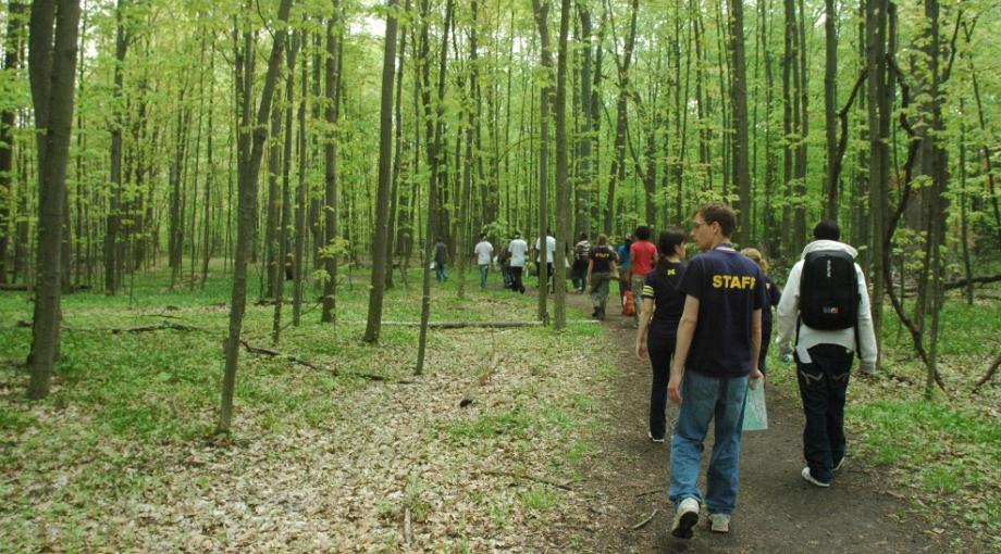 students take nature hike in the spring along trails